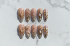 Gold butterfly moon 3D press-on nails flat lay top-down full set almond shape — LuxepressCo