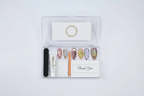 LuxepressCo acrylic packaging box open with aurora holographic press-on nails set and accessories — LuxepressCo