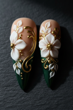 Macro close-up 3D white porcelain flower gold metallic swirl stiletto custom press-on nails dramatic lighting — LuxepressCo