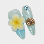 Macro close-up mint blue aurora pearl chrome foil 3D yellow plumeria snail shell aquamarine crystal salon-quality almond press-on nails — LuxepressCo