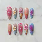 Flat lay top-down full set 10 custom press-on nails floral gradient marble background — LuxepressCo
