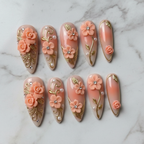 3D peach rose gold filigree floral rhinestone press-on nails hero shot white marble studio custom press-on nails — LuxepressCo