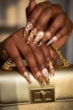 Dark-skin lifestyle leopard print gold chrome drip amber gem custom press-on nails holding gold chain bag — LuxepressCo