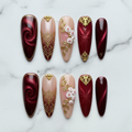 Flat lay top-down full set 10 burgundy baroque custom press-on nails marble — LuxepressCo