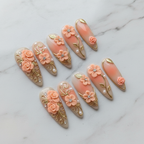 Studio hero shot full set 10 3D peach rose gold filigree custom press-on nails white marble background — LuxepressCo