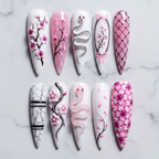 Flat lay top-down full set 10 cherry blossom snake bow lattice custom press-on nails white marble — LuxepressCo