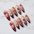 Crimson orchid 3D gold filigree press-on nails hero shot white marble studio custom press-on nails — LuxepressCo