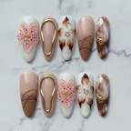 Flat lay top-down full set 10 3D pink flower gold frame magnolia marble salon-quality nails white marble — LuxepressCo