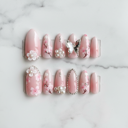Flat lay top-down full set 10 blush pink floral 3D pearl butterfly press-on nails marble — LuxepressCo