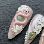 Close-up 3D pink snake jade gemstone jasmine floral custom press-on nails dramatic lighting — LuxepressCo
