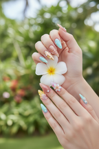 Light-skin hands holding white plumeria wearing pastel watercolor chrome 3D floral custom press-on nails — LuxepressCo