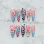 Flat lay top-down full set 10 luxury 3D butterfly floral custom press-on nails white marble — LuxepressCo