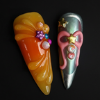 Macro close-up 3D jelly drape and pink bow charm salon-quality press-on nails orange chrome — LuxepressCo