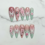 Flat lay top-down full set 10 pink mint butterfly cherry blossom 3D floral rhinestone pearl stiletto press-on nails studio light — LuxepressCo
