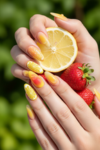 Fair skin hands wearing sunny citrus jelly custom press-on nails holding fresh lemon and strawberries — LuxepressCo