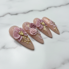 Close-up glossy texture mauve pink 3D floral press-on nails marble background — LuxepressCo