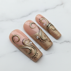 Close-up texture gloss gold swirl nude press-on nails salon-quality reusable nails — LuxepressCo