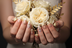 Light skin hands holding cream roses gold dried flowers wearing celestial gold custom press-on nails — LuxepressCo