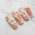 Close-up pink butterfly gold baroque frame floral custom press-on nails glossy texture — LuxepressCo