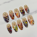 Nude tortoiseshell marble gold charm multicolor rhinestone custom press-on nails almond full set on marble — LuxepressCo