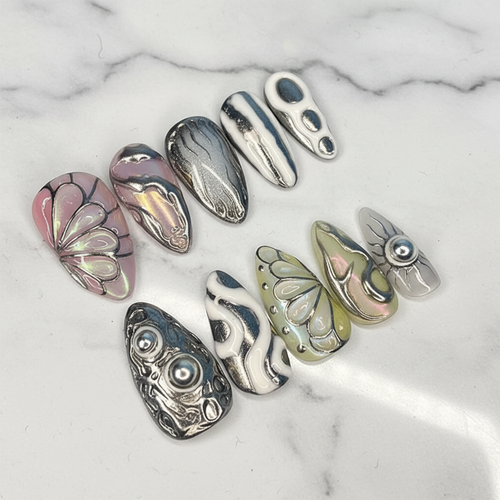 Aurora iridescent lotus butterfly chrome flame custom press-on nails teardrop full set on marble — LuxepressCo