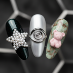 Macro close-up 3D pearl star chrome spiral bear charm custom press-on nails detail — LuxepressCo
