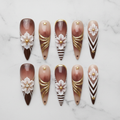 Flat lay top-down full set 10 brown ombre 3D floral gold foil stiletto reusable press-on nails white marble — LuxepressCo