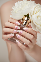 Fair skin lifestyle pink cherry blossom sakura gold foil custom press-on nails holding peonies luxury — LuxepressCo