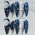 Flat lay top-down full set 10 navy blue 3D rose butterfly custom press-on nails marble — LuxepressCo