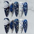 Flat lay top-down full set 10 navy blue 3D rose butterfly custom press-on nails marble — LuxepressCo