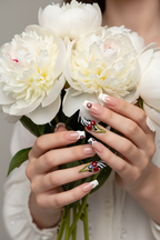 Fair-skin lifestyle Y2K cherry press-on nails coffin nude pink cream swirl holding flowers — LuxepressCo