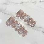 Aurora shimmer custom press-on nails nude beige 3D flower gold foil short oval marble studio — LuxepressCo