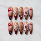 Flat lay top-down full set 10 crimson orchid 3D gold filigree salon-quality nails white marble — LuxepressCo