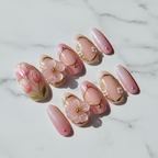 Pink blossom 3D translucent flower charm custom press-on nails soft nude aurora gold frame full set flat lay — LuxepressCo