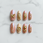 Gold chrome butterfly angel wing 3D custom press-on nails blush pink aurora flat lay overhead — LuxepressCo