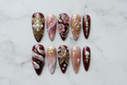 Full set 10 burgundy gold 3D floral pearl custom press-on nails on white marble background — LuxepressCo