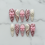 Flat lay top-down full set 10 pink leopard rhinestone bow reusable nails white marble — LuxepressCo