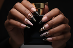 Dark skin hands holding obsidian perfume wearing dark luxury gothic custom press-on nails stiletto — LuxepressCo