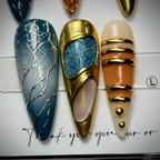Macro close-up gold chrome frame galaxy gem silver marble vein teal blue peach custom press-on nails — LuxepressCo