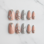 Silver chrome botanical vine custom press-on nails flat lay 10 nails overhead white marble — LuxepressCo