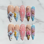 Flat lay top-down full set 10 3D floral sculptured custom press-on nails white marble — LuxepressCo