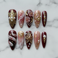 Flat lay top-down view 10 burgundy gold pearl 3D floral custom press-on nails — LuxepressCo