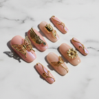 Gold chrome butterfly angel wing 3D custom press-on nails blush pink aurora full set studio hero — LuxepressCo