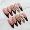 Burgundy gold 3D floral press-on nails hero shot white marble studio custom press-on nails — LuxepressCo