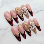 Burgundy gold 3D floral press-on nails hero shot white marble studio custom press-on nails — LuxepressCo