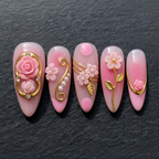 Macro close-up 3D pink rose gold oval frame rhinestone custom press-on nails dramatic lighting — LuxepressCo