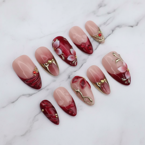 Red magnolia 3D flower gold chrome vine swirl custom press-on nails dark red romance burgundy ombre full set flat lay — LuxepressCo