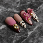 Macro close-up mauve ombre 3D magenta flower gold heart charm salon-quality press-on nails — LuxepressCo