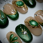 Macro close-up emerald chrome cat-eye 3D scarab beetle gold vine rhinestone salon-quality nails detail — LuxepressCo