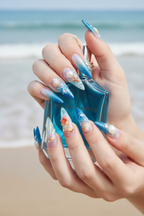 Light-skin hands holding blue sea glass perfume wearing deep ocean blue glitter jelly starfish custom press-on nails — LuxepressCo